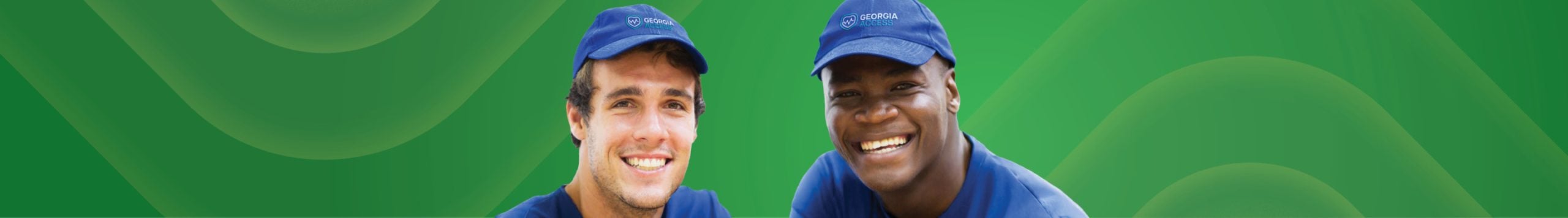 Two men smiling.